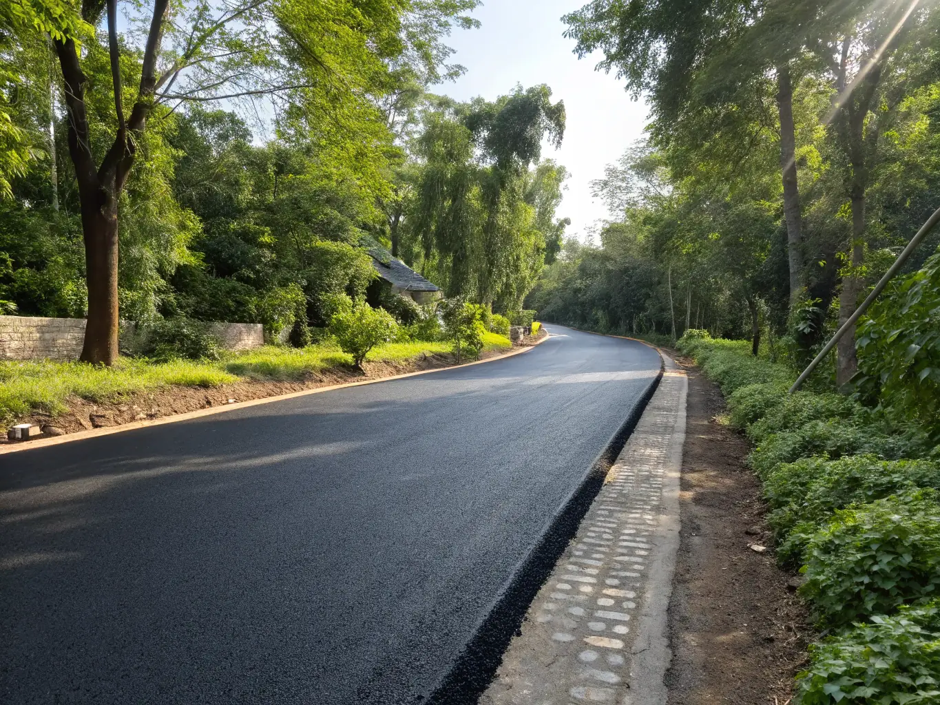 A long-lasting asphalt road paved by All The Way Paving, with cars driving smoothly on it, demonstrating durability and reliability.